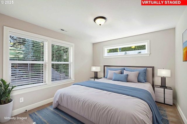 2760 SW Sylvania Ter, Portland, OR 97219 - carpeted bedroom featuring multiple windows