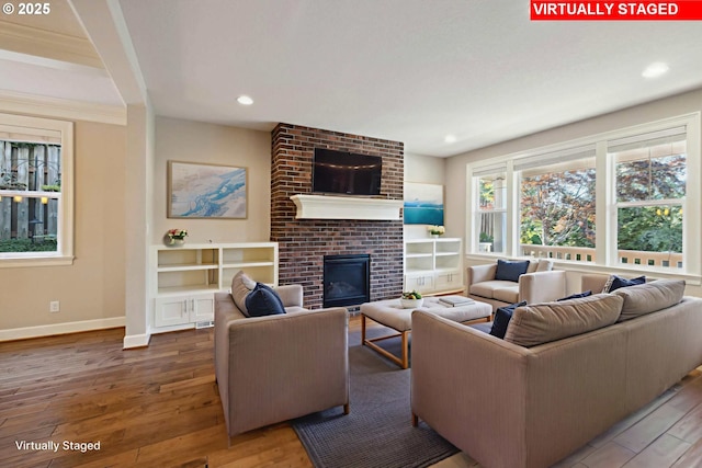 2760 SW Sylvania Ter, Portland, OR 97219 - living room with a brick fireplace, wood finished floors, and recessed lighting