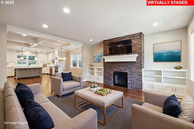 2760 SW Sylvania Ter, Portland, OR 97219 - living area featuring wood finished floors, recessed lighting, a chandelier, beamed ceiling, and coffered ceiling