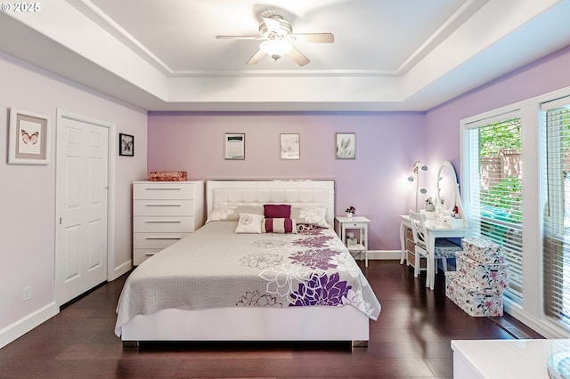 1406 NW Slocum Way, Portland, OR 97229 - bedroom with a raised ceiling, dark wood finished floors, and a ceiling fan