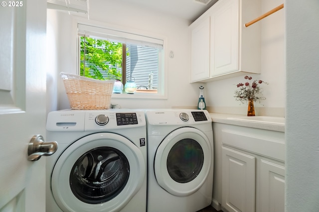 1406 NW Slocum Way, Portland, OR 97229 - laundry room with cabinet space and washing machine and dryer