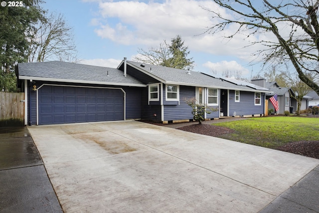 ranch-style house with a front yard and a garage