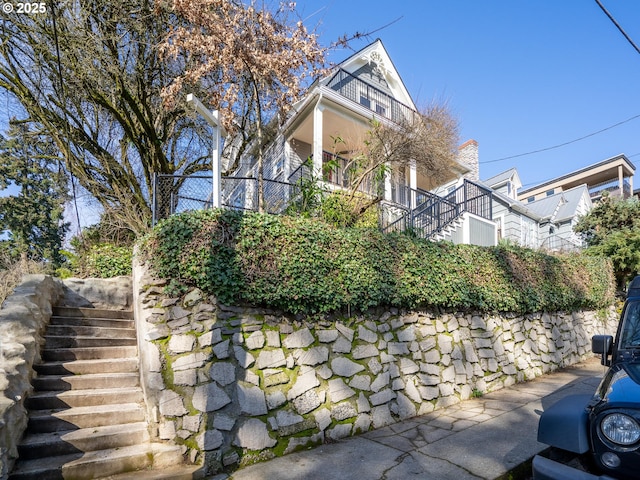 view of property exterior with stairs