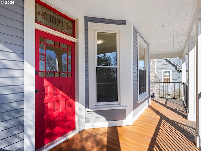 entrance to property featuring a porch