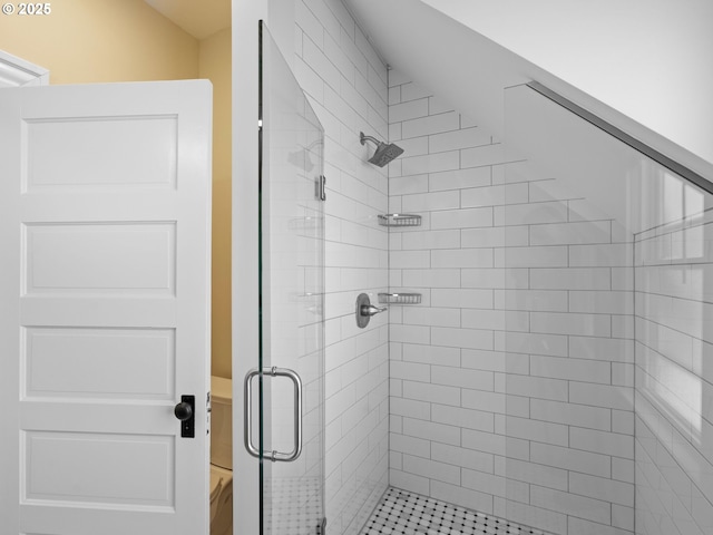 bathroom featuring a shower stall