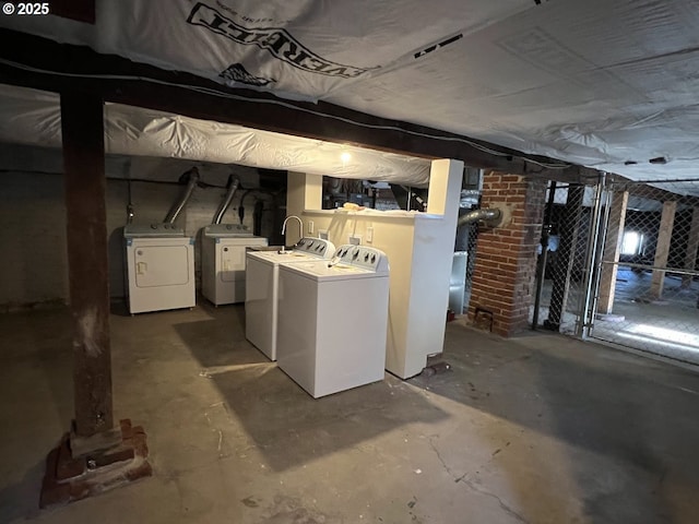 unfinished below grade area with washing machine and dryer