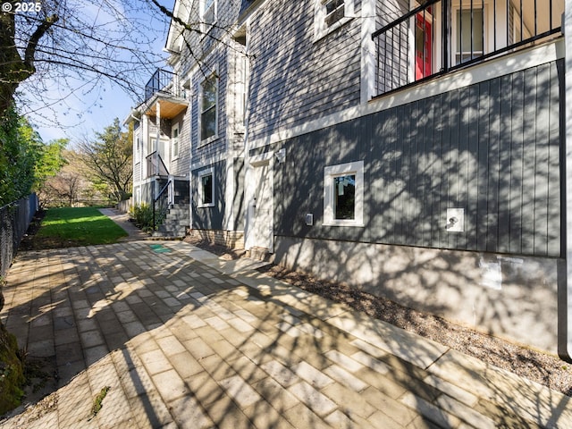 exterior space with a patio and fence