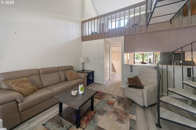 43605 State Highway 38 Unit 9, Reedsport, OR 97467 - living room with wood finished floors, a high ceiling, and baseboards