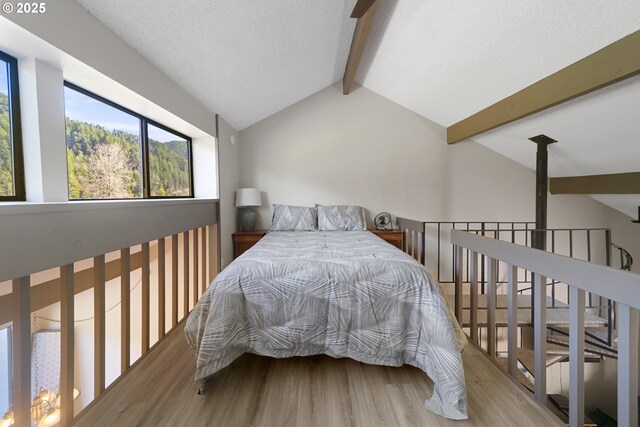 43605 State Highway 38 Unit 9, Reedsport, OR 97467 - bedroom with wood finished floors and a textured ceiling
