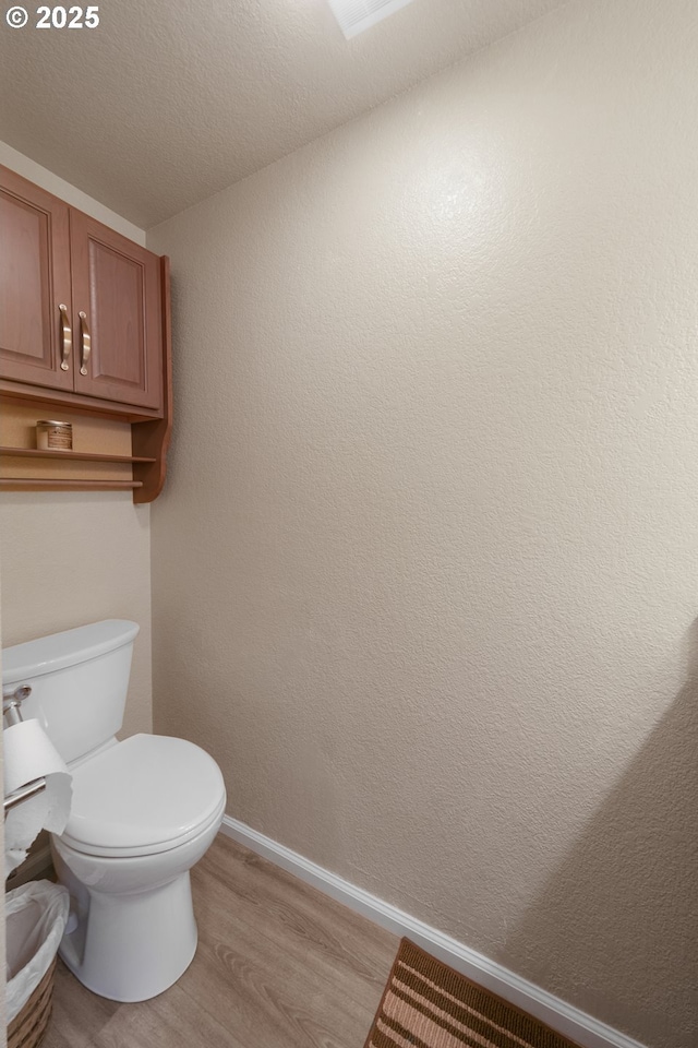 43605 State Highway 38 Unit 9, Reedsport, OR 97467 - bathroom with wood finished floors, baseboards, and toilet