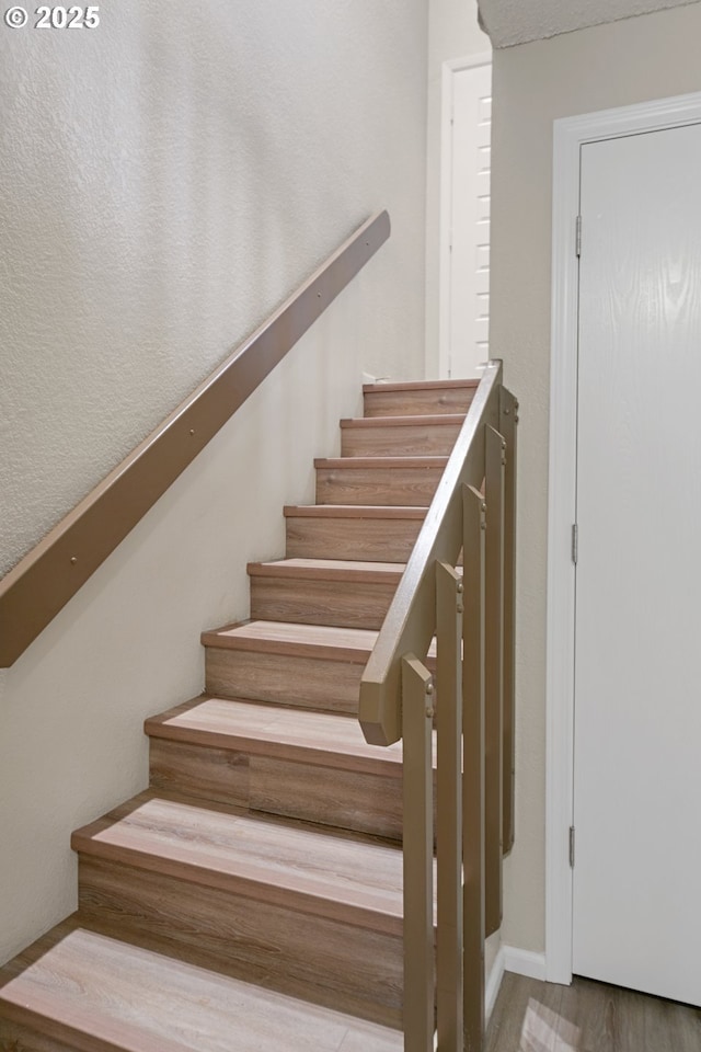 43605 State Highway 38 Unit 9, Reedsport, OR 97467 - stairway featuring wood finished floors and baseboards