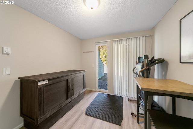43605 State Highway 38 Unit 9, Reedsport, OR 97467 - office area with light wood-style floors, a textured ceiling, and baseboards
