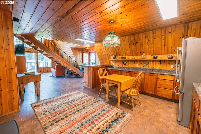 5920 Elkhead Rd, Yoncalla, OR 97499 - dining area featuring wooden walls, wooden ceiling, and stairway