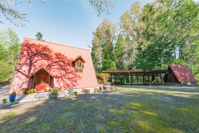 5920 Elkhead Rd, Yoncalla, OR 97499 - view of front facade with metal roof and a detached carport