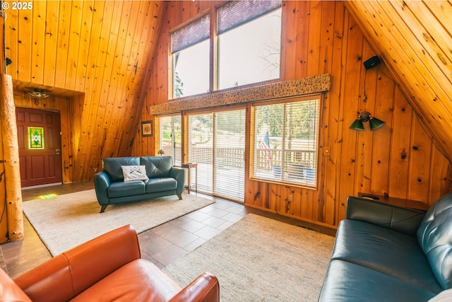 5920 Elkhead Rd, Yoncalla, OR 97499 - living area featuring wood walls, plenty of natural light, and a towering ceiling