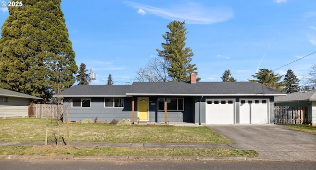 ranch-style home with a garage and a front yard