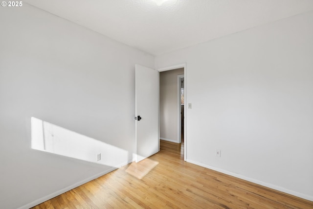 unfurnished room featuring light wood-type flooring