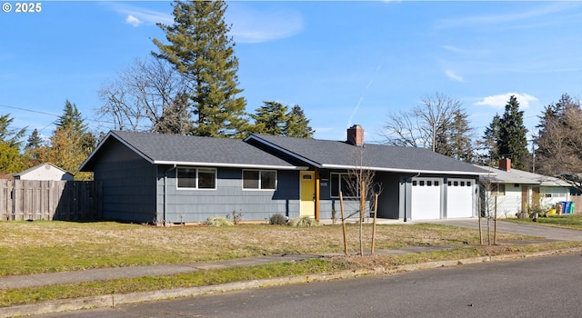 ranch-style home with a front lawn and a garage