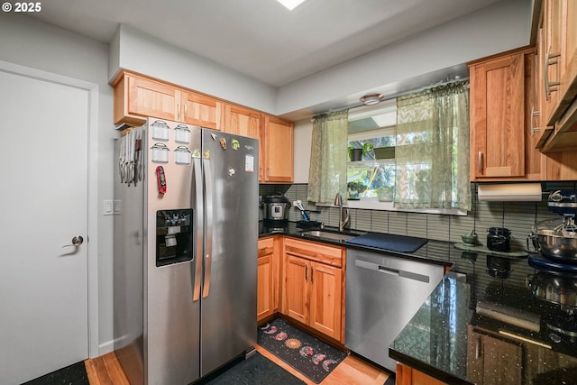 7360 SE Imperial Ct, Milwaukie, OR 97222 - kitchen featuring stainless steel appliances, decorative backsplash, dark stone countertops, and light wood-style floors