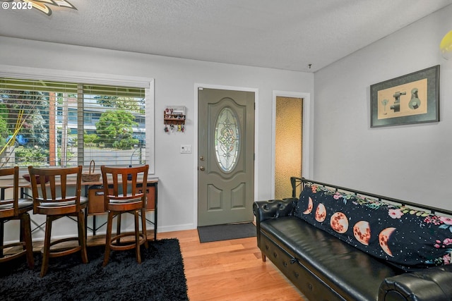 7360 SE Imperial Ct, Milwaukie, OR 97222 - entryway with light wood finished floors and a textured ceiling