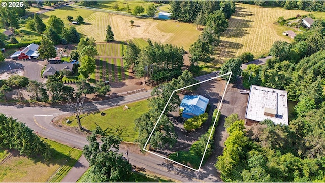 birds eye view of property featuring a rural view