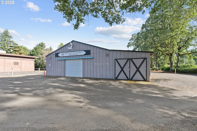 view of outbuilding with a garage