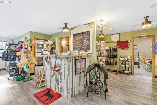 bar with light wood-type flooring