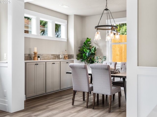 dining area with light wood-style floors