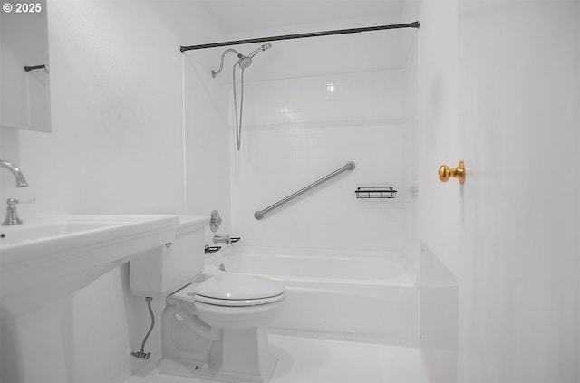 bathroom featuring bathing tub / shower combination and toilet