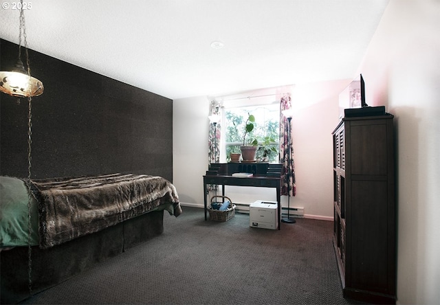 bedroom with a baseboard heating unit, baseboards, and dark carpet