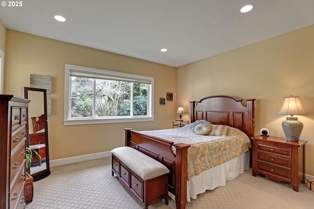 bedroom with recessed lighting, baseboards, and light colored carpet