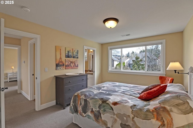 bedroom with visible vents, baseboards, and carpet