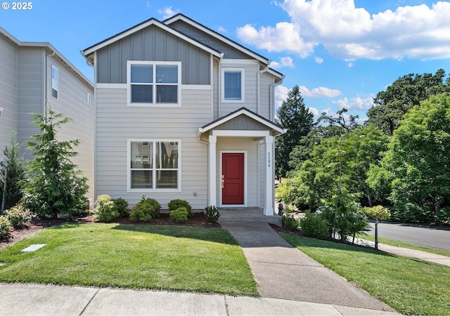2504 Brackenfern Rd, Eugene, OR 97403 - view of front of house with board and batten siding and a front yard