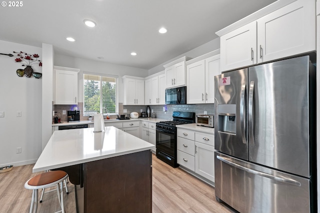 2504 Brackenfern Rd, Eugene, OR 97403 - kitchen featuring black appliances, light wood-type flooring, a sink, backsplash, and recessed lighting