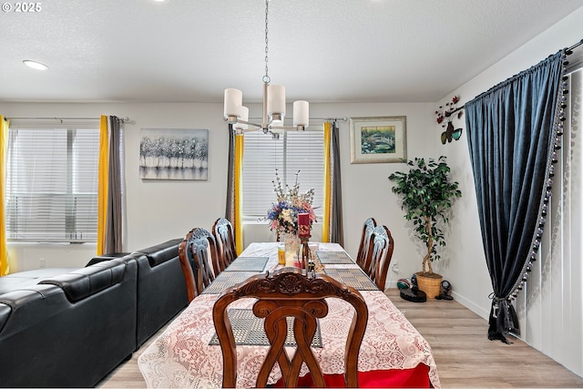 2504 Brackenfern Rd, Eugene, OR 97403 - dining area featuring a chandelier, light wood finished floors, a textured ceiling, baseboards, and recessed lighting