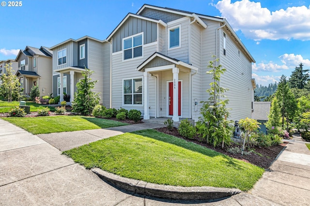 2504 Brackenfern Rd, Eugene, OR 97403 - view of front of house with board and batten siding and a front yard