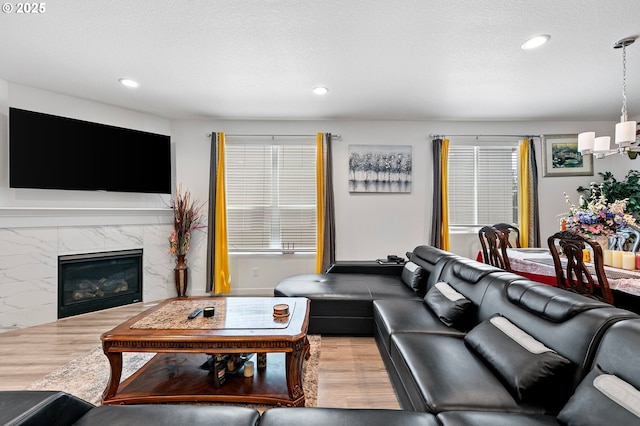 2504 Brackenfern Rd, Eugene, OR 97403 - living room with wood finished floors, recessed lighting, and a fireplace