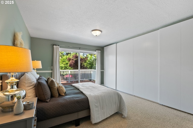 6025 SW Spruce Ave, Beaverton, OR 97005 - carpeted bedroom featuring a textured ceiling and access to outside