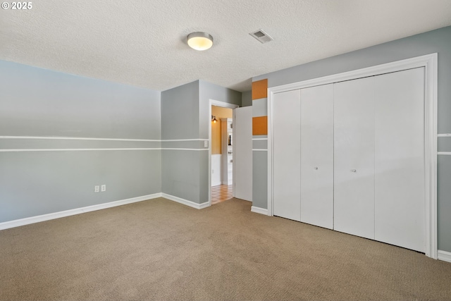 6025 SW Spruce Ave, Beaverton, OR 97005 - unfurnished bedroom featuring carpet flooring, a closet, a textured ceiling, and baseboards