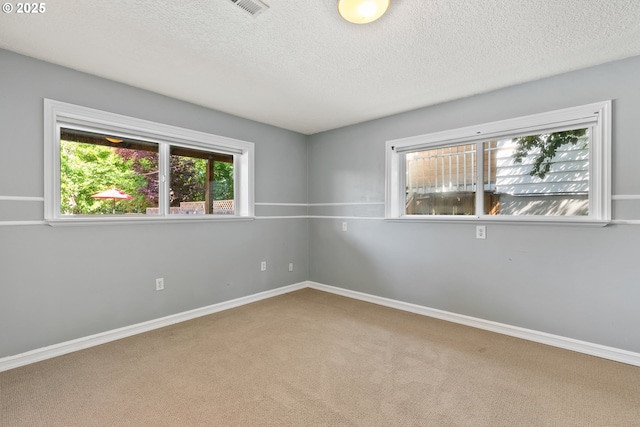 6025 SW Spruce Ave, Beaverton, OR 97005 - carpeted spare room with a textured ceiling and baseboards