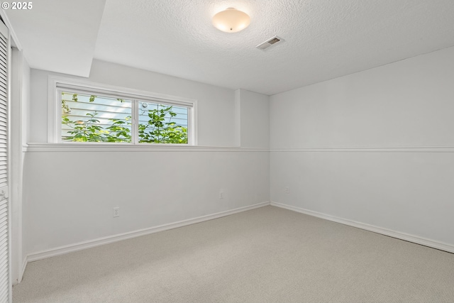 6025 SW Spruce Ave, Beaverton, OR 97005 - carpeted empty room featuring a textured ceiling and baseboards
