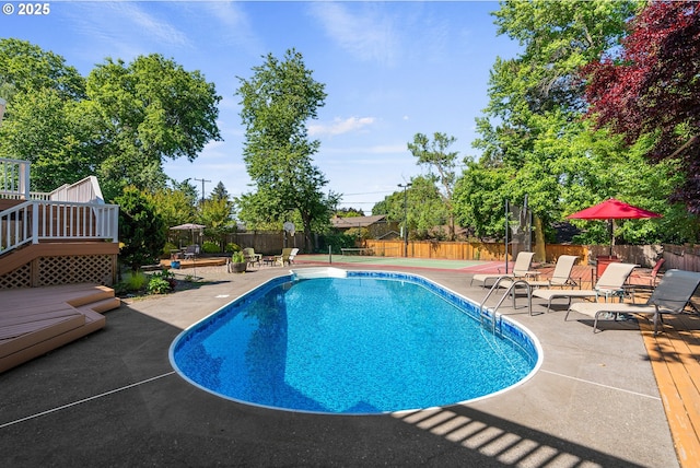 6025 SW Spruce Ave, Beaverton, OR 97005 - view of pool with a patio area, a wooden deck, and a fenced backyard