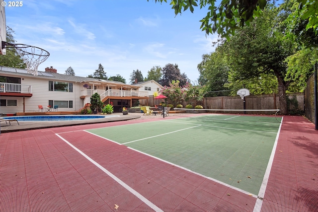 6025 SW Spruce Ave, Beaverton, OR 97005 - view of tennis court with a deck and stairs