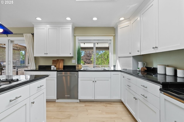 6025 SW Spruce Ave, Beaverton, OR 97005 - kitchen with stainless steel appliances, healthy amount of natural light, light wood-style floors, white cabinets, and recessed lighting