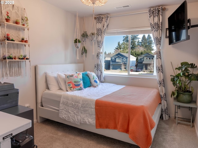 bedroom with light colored carpet