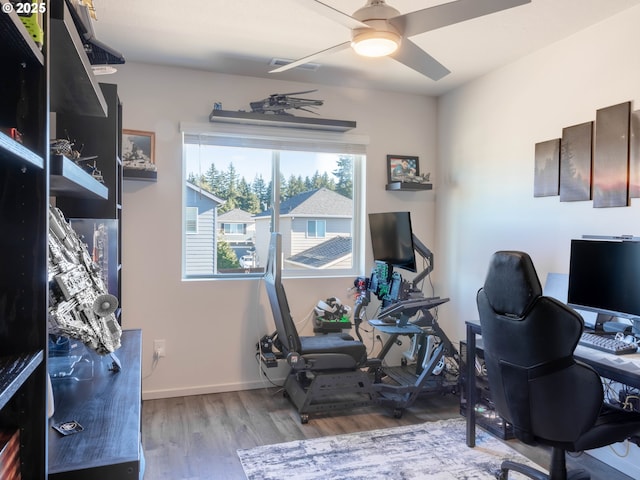 office with ceiling fan and light wood-type flooring