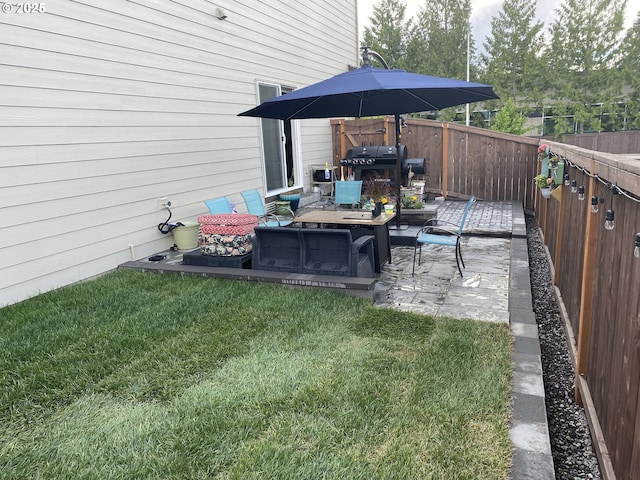 view of yard with outdoor lounge area and a patio