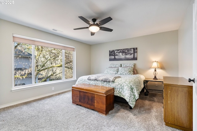 bedroom with carpet floors, visible vents, baseboards, and ceiling fan