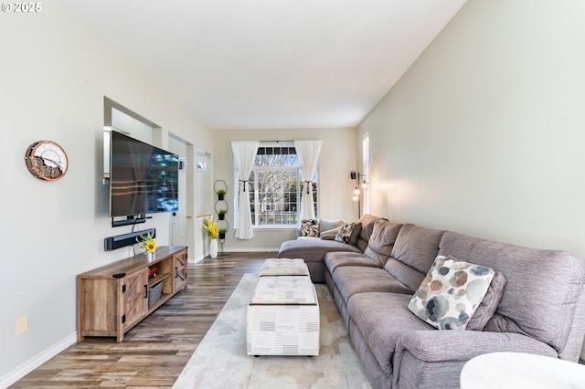 living room with baseboards and wood finished floors