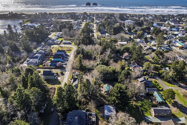 birds eye view of property with a residential view and a water view